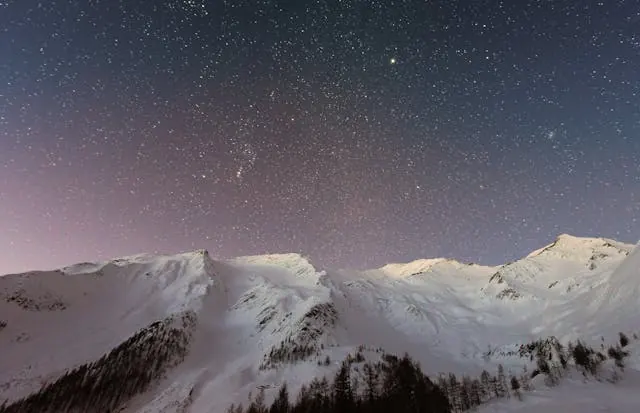 Snow-covered mountain range at dusk